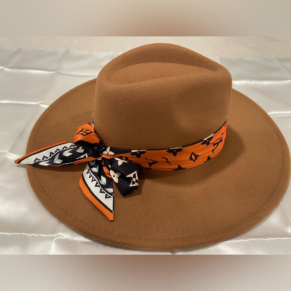 Stylish Brown Hat with Orange Scarf Accent